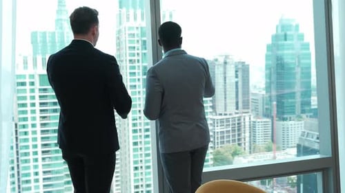 Diverse team of ambitious business people standing in ornamented office city