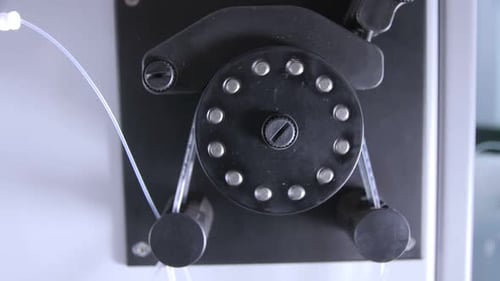 Machine Pumping Fluid Through Clear Tube