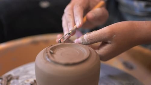 Professional Craftsman Potter Making Jug on Potter Wheel Circle