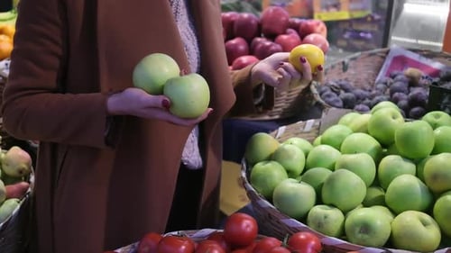 Young Woman Choosing Fuits at Fruit Vegetable Shelf in Grocery Store Healthy Food Nutrition