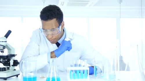 Pensive Scientist Contemplating Experiment in Bright Lab