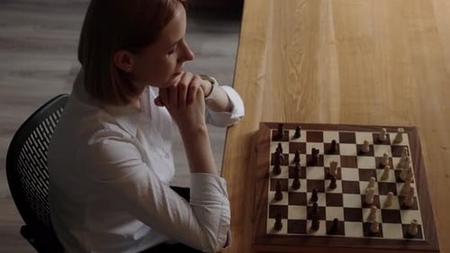 Business Woman Thinking Playing Chess