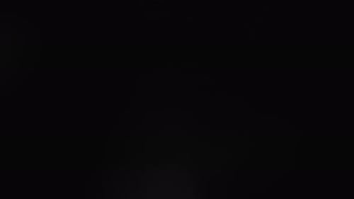 Abstract Shimmering Bokeh Lights on Dark Background
