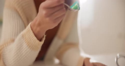 Person Eats Slice of Rainbow Cake with Spoon