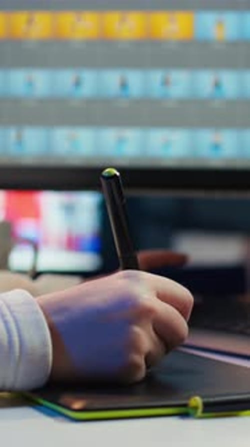 Hands Using Stylus and Graphics Tablet Close Up