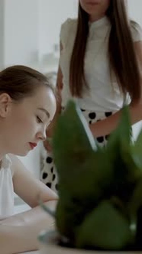 Women Writing Together Indoors