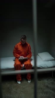 Female Inmate Reading Book in Prison Cell, People Stock Footage ft ...