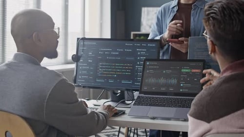 Indian Developers Collaborating on Software Development in Office