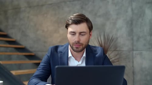 Closeup Focused Businessman Working on Laptop Computer at Remote Office. Portrait Of