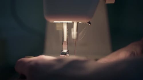 A close-up of a woman using a sewing
