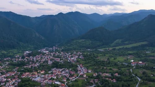 View From Rock to Town of Smolyan with Meadows for Cattle Walking and Houses Between Mountain Range