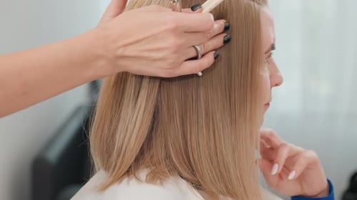 Woman Getting Haircut in Salon, Close Up