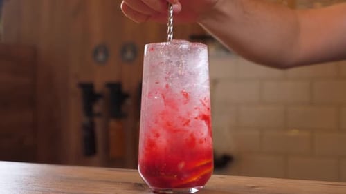 Refreshing Beverage Preparation at a Bar