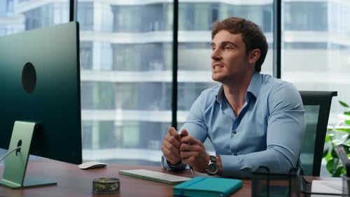 Professional man video conferencing in modern office setting