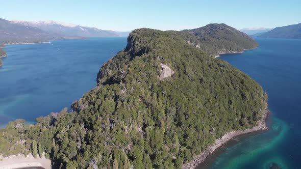 Rising aerial of Los Arrayanes National Park on Lago Nahuel Huapi ...