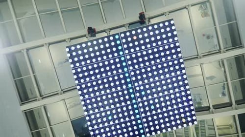 Camera Turns Around Under Illuminating Construction in Mall