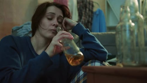 Close Up Face Alcoholic Young Woman Hold Drink Beer Sit on Floor Home Stress Unhealthy Creepy