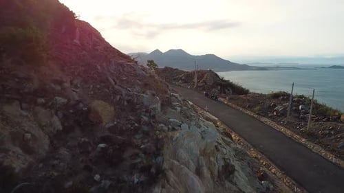 Scenic View of Paved Highway on the Mountains with Rocky Cliff and Ocean View
