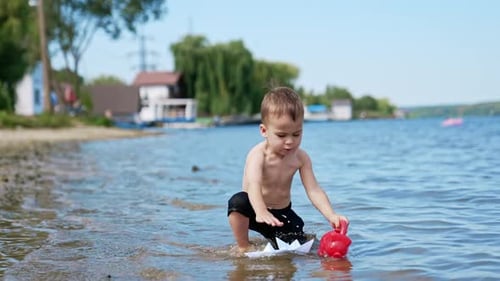 Water summertime lifestyle. Summer child having fun on a river.