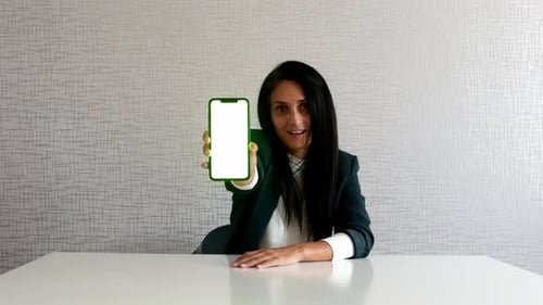 Excited Woman Show Phone With Green Screen