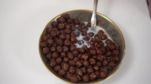 Chocolate Cereal and Milk in Bowl