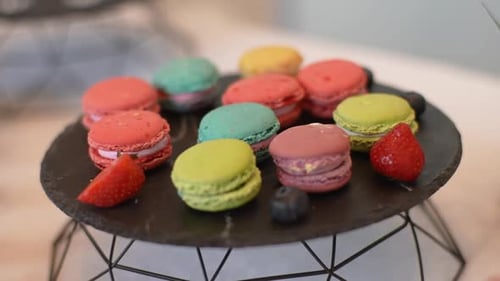 Close Up Tracking Shot of Tasty Macarons on Plates and Trays During Banquet