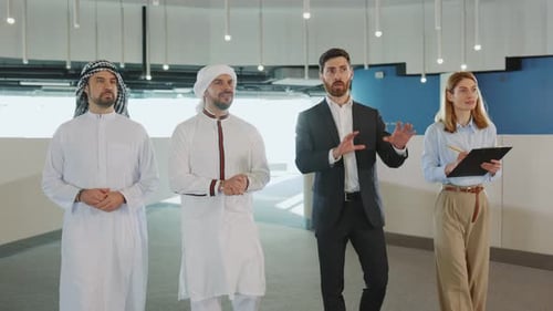 Business discussion between Arab men and Western coworkers