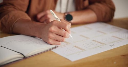 Hand, writing and calendar for schedule, planning and organization with timeline for tasks or event