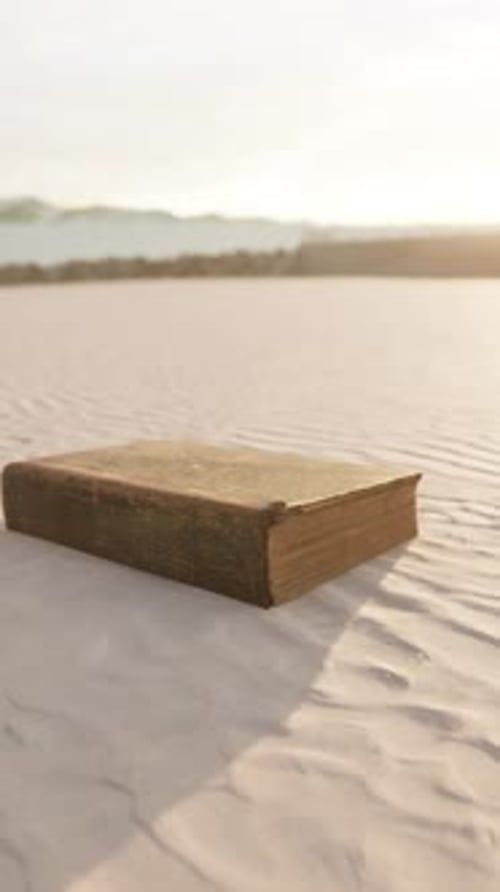 Old Book on the Sand Beach