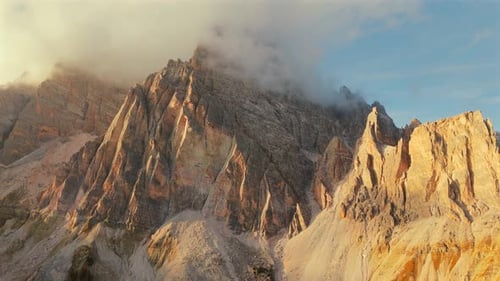 Aerial View of High Mountain Range with Clouds in Dolomites Italy