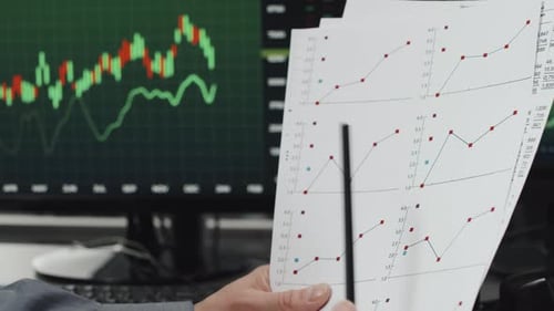 Financial Professional Analyzing Stock Data in Office
