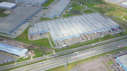 Aerial view of goods warehouse. Logistics center in industrial city zone from above. Aerial view of