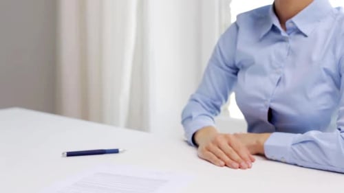 Business partners shake hands over contract at office for successful deal