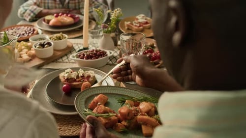People Enjoying Meal Together at Home