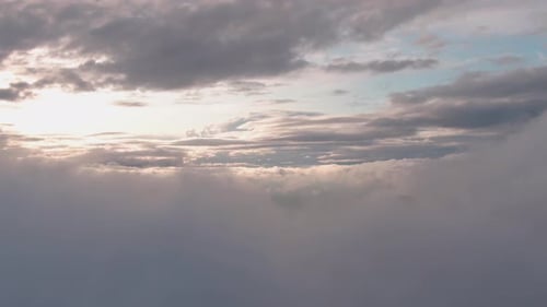 Drone shot over peaceful clouds during sunset background, no people