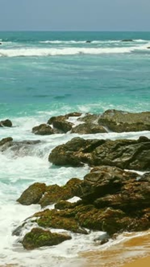 Tropical ocean waves and rocks