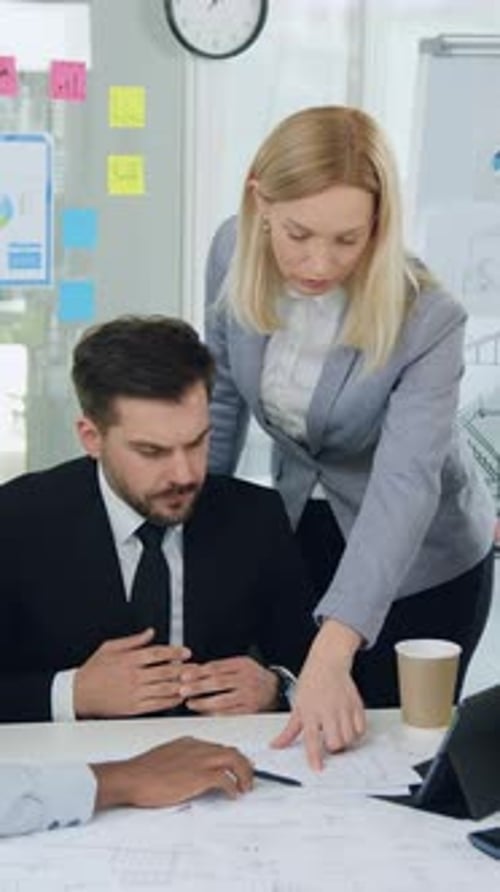 Building Industry Concept Where Likable Concentrated Professional Multiracial Contractors Discussing