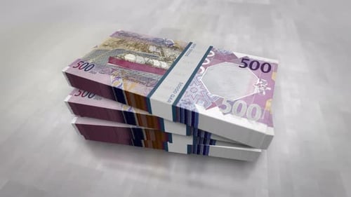 Qatar Riyal money banknote pile packs