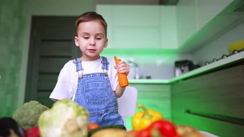 Young Boy Enjoys Vegetables at Kitchen Table