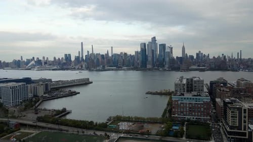 Aerial view the Hudson Yards skyline, from Hoboken Jersey city, in New York - circling, drone shot