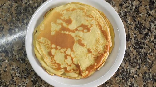 Delicious Stack of Pancakes on White Plate