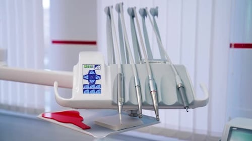 Set of tools for dental treatment at a dental clinic. Modern equipment in dentist cabinet.