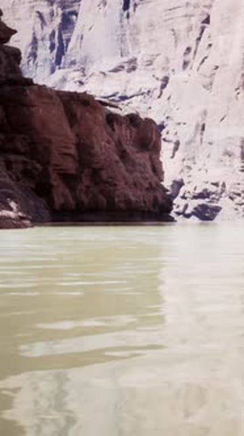 A Breathtaking View of a Serene Lake Nestled Within Towering Cliffs