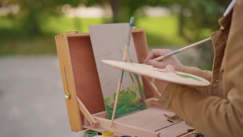 Painter Sketches on Portable Easel Street Scene Captured By Artist with Palette Portrait of Painter