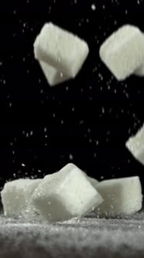 Sugar Cubes Fall on the Table Filmed on a Highspeed Camera at 1000 Fps