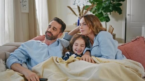 Parents Kid Gathering Couch in Cozy Living Room Closeup Couple and Girl Resting