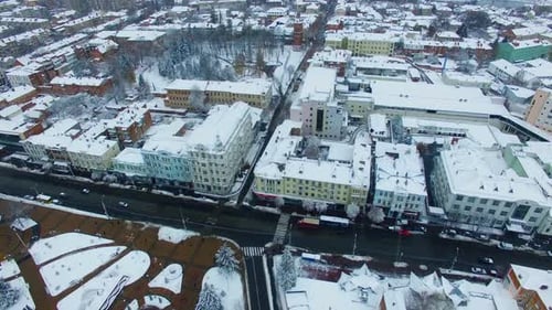 Snowy roofs of the buildings in the city downtown.
