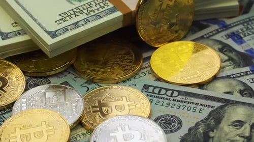 Bitcoin crypto currency with one hundred dollar bills