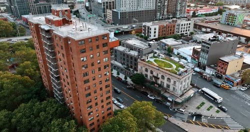 Urban landscape with blocks of flats and roads. Green areas on the tops of the houses.