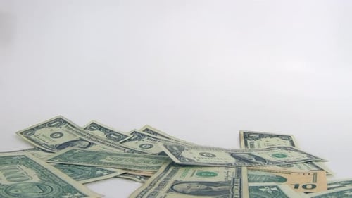 Money Cash, Us Dollars bills falling in slow motion, studio illustration of American currency